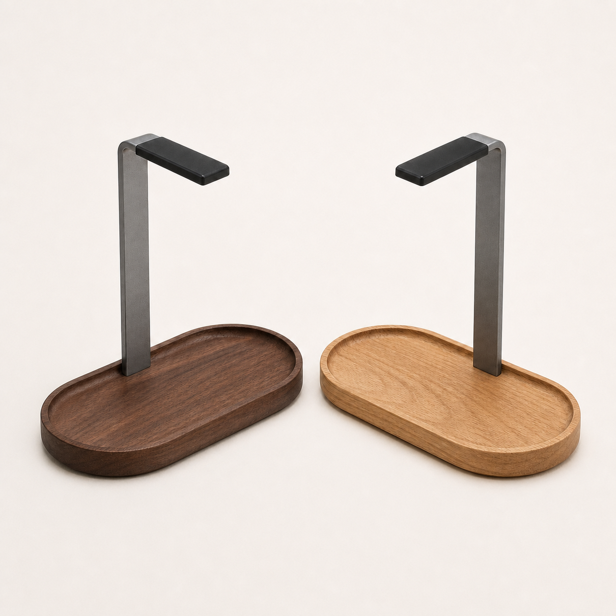 Walnut and oak solid wood headphone stands on a square off-white background