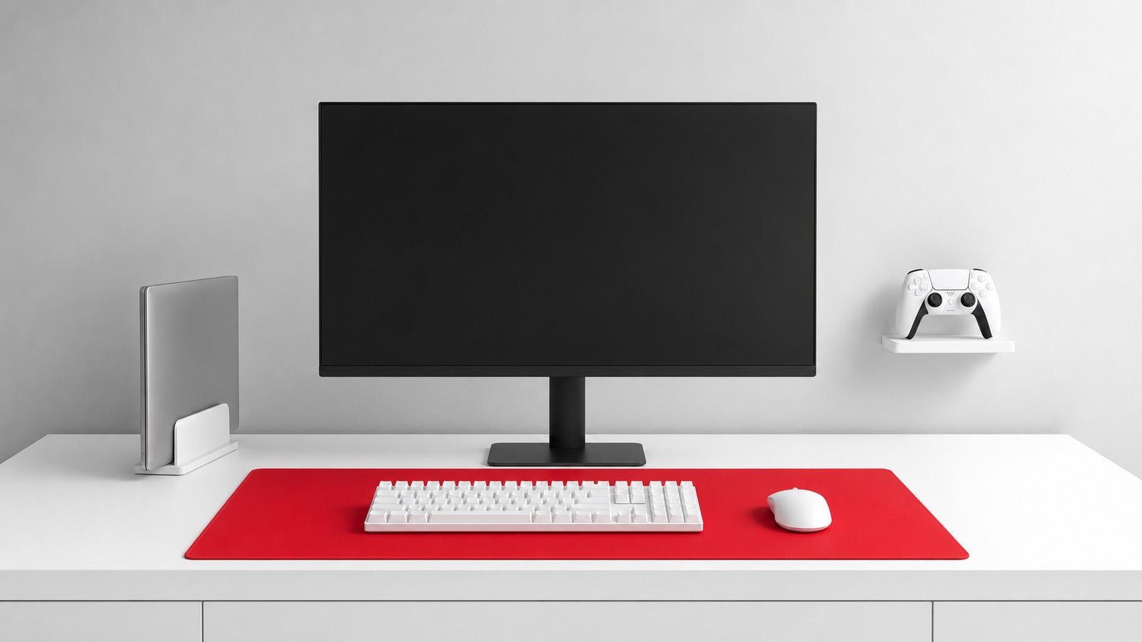 Bright white clean gaming desk with a centered monitor, red mat, and hidden cables