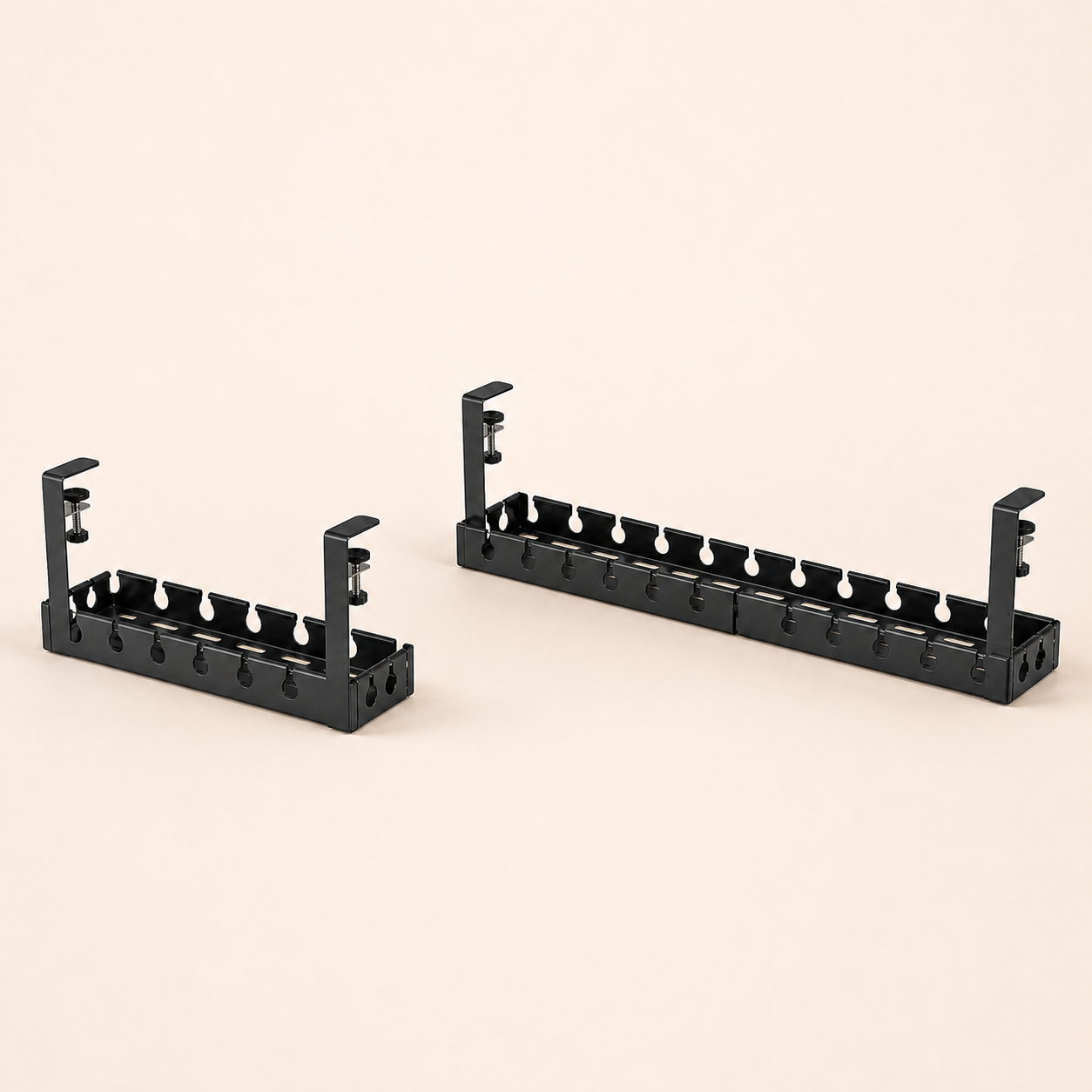 Fixed and retractable black clamp-on under-desk cable trays on a square off-white background